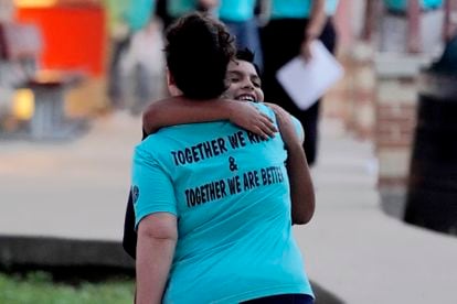 For the first day of classes, many Uvalde teachers wore T-shirts saying, “Together we rise & Together we are better.” Pictured above, a teacher hugs a student at the entrance to Uvalde Elementary.