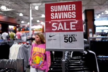 A sale sign is displayed for clothes at a retail store in Vernon Hills