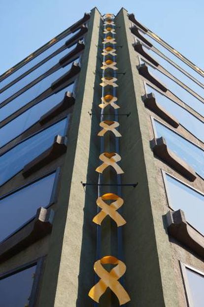 Yellow ribbons adorn a building in Barcelona.