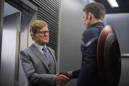 Welcome aboard: Robert Redford (l) greets defrosted superhero Steve Rogers (Chris Evans) in 'Captain America: The Winter Soldier.'