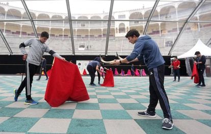Students at practice at the bullfighting academy.