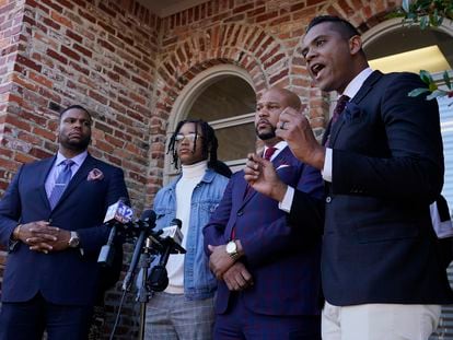 FedEx driver D'Monterrio Gibson, second from left, stands with his legal team of attorneys in Ridgeland, Mississippi, in 2022.