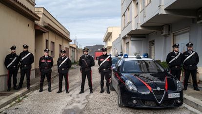 Italian police officers guard the street leading to Mattelo Messina's home in Campobello di Mazzara.
