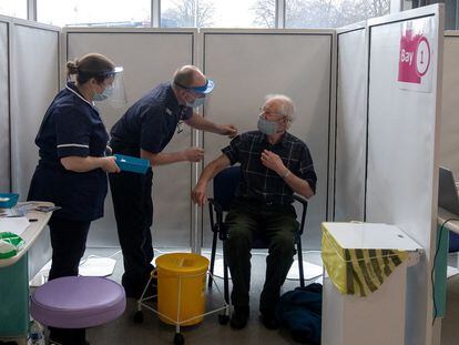 A 67-year-old man receives the Oxford-AstraZeneca vaccine in Britain.