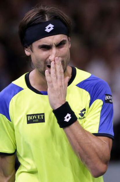 Spain's David Ferrer reacts after a point against Serbia's Novak Djokovic.