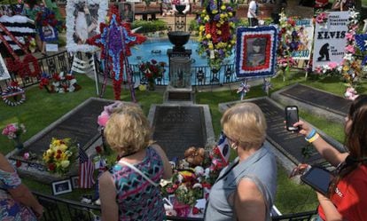 Elvis Presley fans visit his grave in Memphis on August 12. 