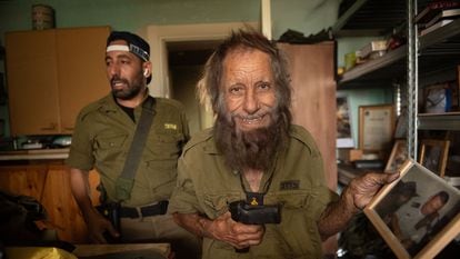 The reservist Ishashi El Hagah and his father Shlomo El Hagah in their home in Kyriat Shmona, near the border with Lebanon.