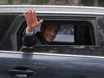 French President Emmanuel Macron leaves after voting in Le Touquet, northern France, on June 19.