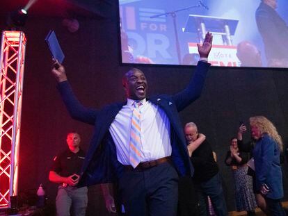 Colorado Springs mayoral candidate Yemi Mobolade cheers as he runs onto the stage to give a speech, Tuesday, May 16, 2023.