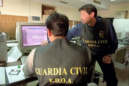 Officers from the Civil Guard's technology branch at work.