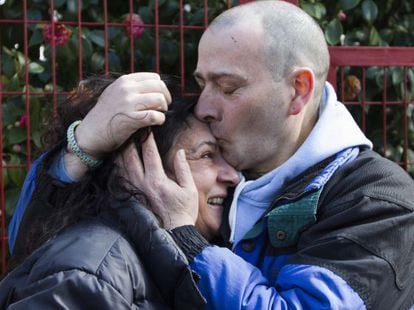 David Reboredo hugs his girlfriend after his release Monday. 