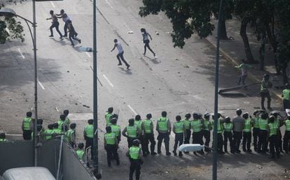 April 8. Protestors flee riot police in Caracas.