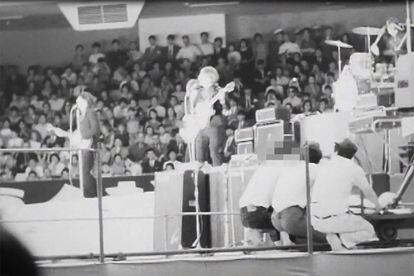 The Beatles, Ringo Starr (top R), John Lennon (C-front), Paul McCartney (L) and George Harrison (C-behind) in concert at the Nippon Budokan in Tokyo. 