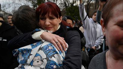 Inessa hugs her son Vitali after he arrives in Kyiv from Russian-controlled Ukrainian territory on March 22, 2023.