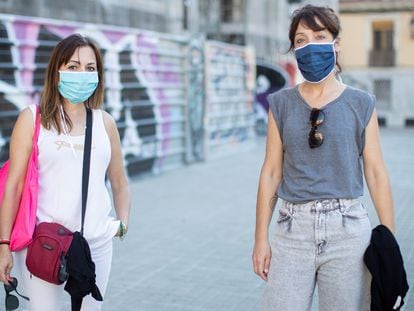 Two women wearing face masks in Barcelona on Tuesday.