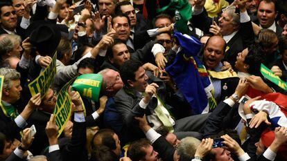 Opponents celebrate Congress's decision to approve impeachment of Rousseff.