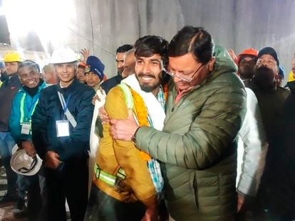 Pushkar Singh Dhami, right, Chief Minister of the state of Uttarakhand, greeting a worker rescued in Silkyara in the northern Indian state of Uttarakhand. Nov. 28, 2023.