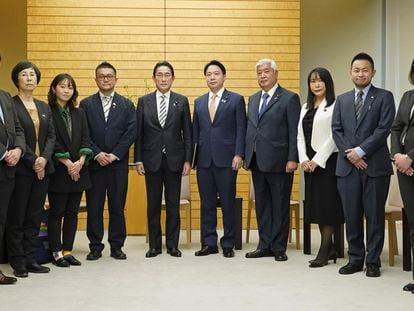Japanese Prime Minister Fumio Kishida, center left, poses with the leaders of LGBTQ groups, as Kishida apologized to them over his former aide’s discriminatory remarks, at the prime minister's office in Tokyo, Friday, Feb. 17, 2023.