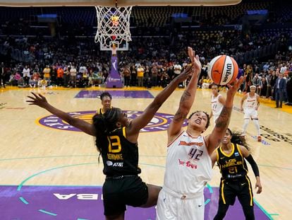 Los Angeles Sparks forward Chiney Ogwumike (13) defends against Phoenix Mercury center Brittney Griner (42) during the first half of a WNBA basketball game in Los Angeles, Friday, May 19, 2023.