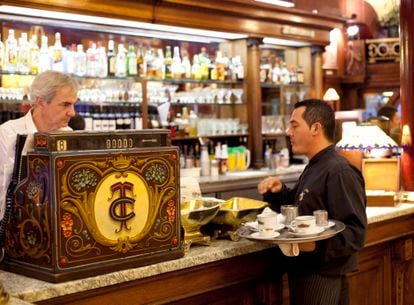 Waiters at the bar of the historic Tortoni café, one of the most famous in Buenos Aires.