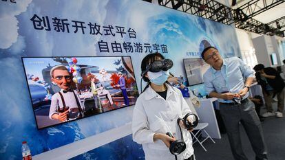 A visitor wearing virtual reality glasses at the ZGC Forum in Beijing on Friday.
