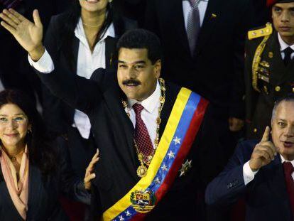 President Nicolás Maduro waves alongside his wife and Speaker Diosdado Cabello on Tuesday night.