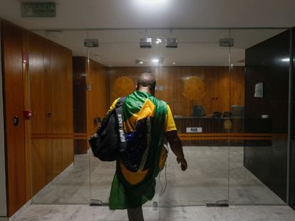 One of the protesters, a supporter of Jair Bolsonaro, inside the Congress building