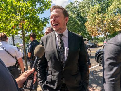 Elon Musk, CEO of X, the company formerly known as Twitter, laughs while speaking to the media after attending a closed-door gathering of leading tech CEOs to discuss the priorities and risks surrounding artificial intelligence and how it should be regulated, on Capitol Hill in Washington, Wednesday, Sept. 13, 2023.