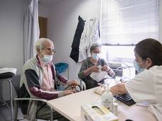 A nurse treats Manuel Fernández, 90, at the Besòs primary healthcare center in Barcelona.