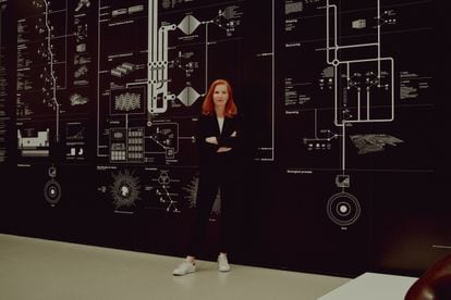 Kate Crawford in front of 'Anatomy of an AI system', the work she created with artist Vladan Joler.