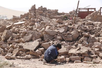 A boy cries as he sits next to debris, in the aftermath of an earthquake in the district of Zinda Jan, in Herat, Afghanistan, October 8, 2023.