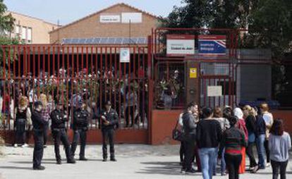 People gather for a ceremony at Ciudad de Jaén High School on Monday.