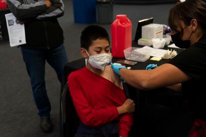 Johnny Thai, 11, receives the Pfizer COVID-19 vaccine at a pediatric vaccine clinic for children ages 5 to 11 set up at Willard Intermediate School in Santa Ana, Calif., Nov. 9, 2021.