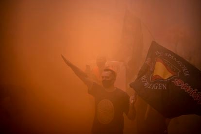 Protesters set off a flare at the homophobic march in Madrid.