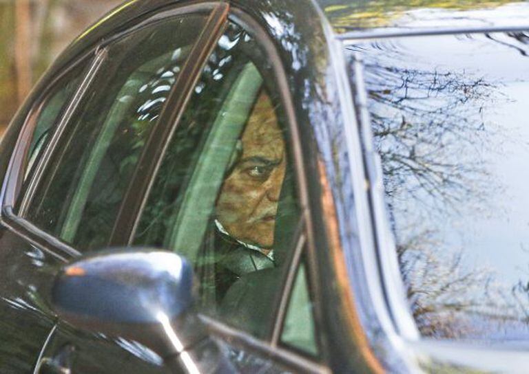 Diáz Ferrán is driven from his home after he was arrested on December 3.