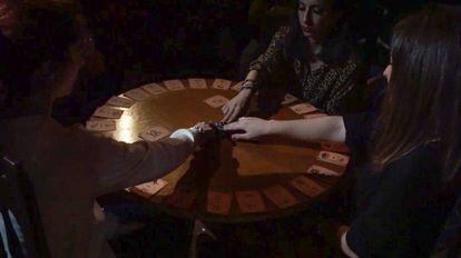 A theatrical séance during a performance at the Among Sprits experience in Madrid.
