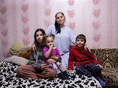 Olga, who suffered from very aggressive tuberculosis three years ago, and three of her five children at home in Bălți, Moldova.