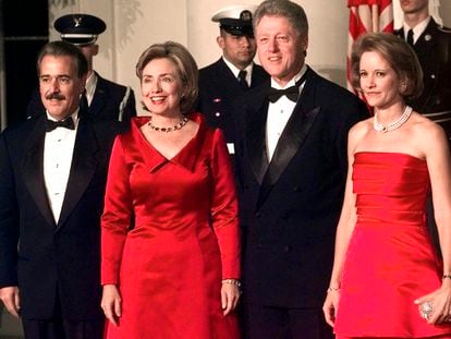 President Clinton and first lady Hillary Clinton pose for a photo with President of Colombia Andres Pastrana, left, and first lady of Colombia Nohra Puyana de Pastrana, right, after they arrived at the White House in Washington, Oct. 28, 1998 for a state dinner.