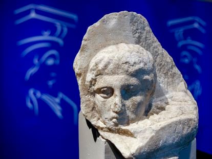 The marble head of a young man, a tiny fragment from the 2,500-year-old sculptured decoration of the Parthenon Temple on the ancient Acropolis, is displayed during a presentation to the press at the new Acropolis Museum in Athens, Nov. 5, 2008.