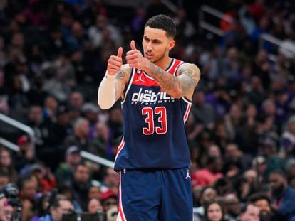 Washington Wizards forward Kyle Kuzma gestures to teammates during the second half of an NBA basketball game against the Sacramento Kings on March 18, 2023, in Washington.