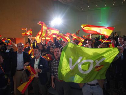 Vox supporters celebrate the election results.