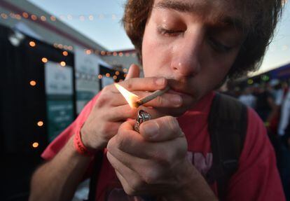 In this file photo a man lights a joint at the annual DOPE Cup, a cannabis competition in Portland, Oregon, on October 4, 2015.