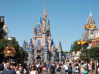 Visitors walk along Main Street at The Magic Kingdom at Walt Disney World in Orlando, Florida, in 2022.