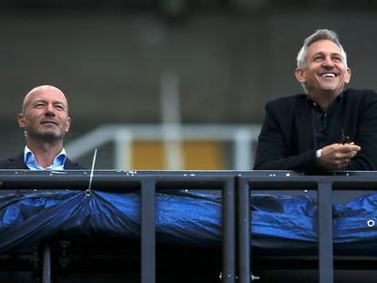 TV soccer pundits and former soccer players Alan Shearer, left, and Gary Lineker watch the FA Cup sixth round soccer match between Newcastle United and Manchester City at St. James' Park in Newcastle, in June 2020.