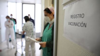 Health workers in Madrid preparing to register patients for vaccination.
