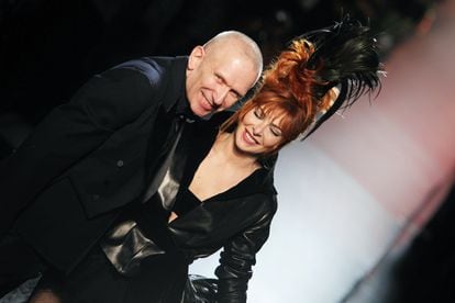 Mylène Farmer with designer Jean Paul Gaultier on the runway of the French fashion house’s fall/winter 2011 haute couture show. 