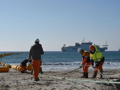 Orange Marine workers install an underwater cable between Singapore and France in March 2016.