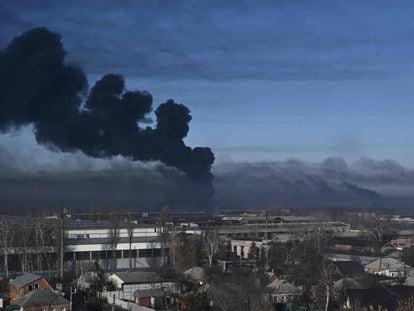 Black smoke rises from a military airport in Chuguyev in Ukraine.