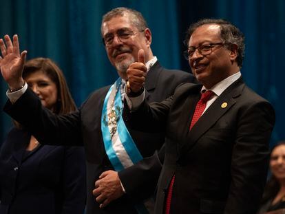 Gustavo Petro and Bernardo Arévalo wave after the swearing-in ceremony in Guatemala, January 14, 2024.
