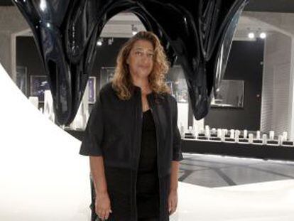 Zaha Hadid poses in the Ivory Press gallery, where her exhibition of paintings, sculptures and designs is currently on show. 